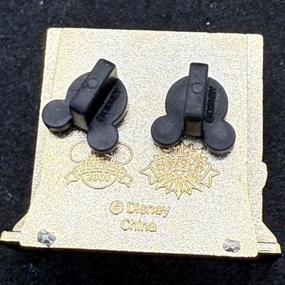 Sale Photo Thumbnail #15: Pin in very good condition. This Disney trading pin features Donald Duck, Mickey Mouse, and Minnie Mouse in a scene inspired by The Twilight Zone Tower of Terror attraction. 
The pin is a diorama-style pin, with Donald dressed as a bellhop leading Mickey 