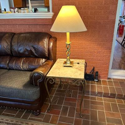 IRON BASE, MARBLE TOP END TABLE AND A TABLE LAMP