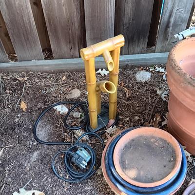PINECONES, CLAY FLOWER POTS, WATER FOUNTAIN TOPS AND MANY POT SAUCERS