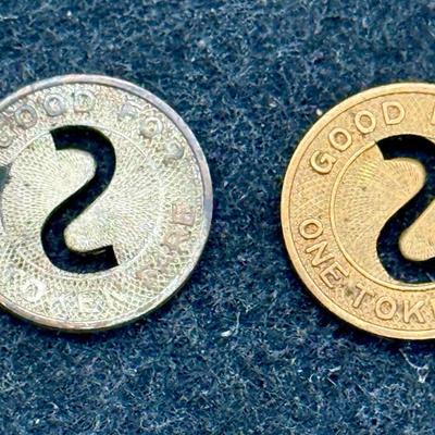 Sale Photo Thumbnail #438: Pair of transit tokens one looks to be made from copper and the other a white metal. Slightly smaller than a US dime. Rare, in very good condition. The San Diego Transit System ran from 1948 until 1967, using a mix of streetcars and busses which were full