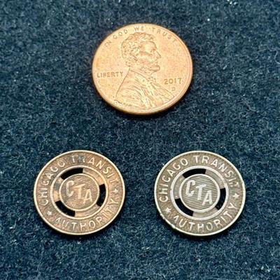 Sale Photo Thumbnail #440: Pair of CTA transit tokens. Slightly smaller than a US dime. Rare, in very good condition. The CTA began operation in 1947, consolidating original operation of the Chicago Surface Lines from 1914. These tokens are likely from the mid 1940's or 1950's.