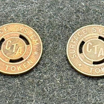 Sale Photo Thumbnail #441: Pair of CTA transit tokens. Slightly smaller than a US dime. Rare, in very good condition. The CTA began operation in 1947, consolidating original operation of the Chicago Surface Lines from 1914. These tokens are likely from the mid 1940's or 1950's.