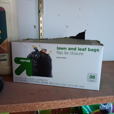 FULL CONTAINER OF DECK CLEANER, PARTIAL BOXES OF TRASH BAGS AND A SPRAYER