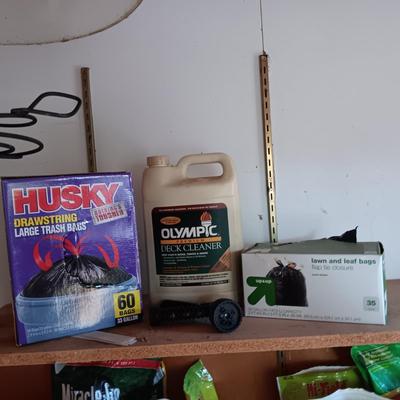 FULL CONTAINER OF DECK CLEANER, PARTIAL BOXES OF TRASH BAGS AND A SPRAYER