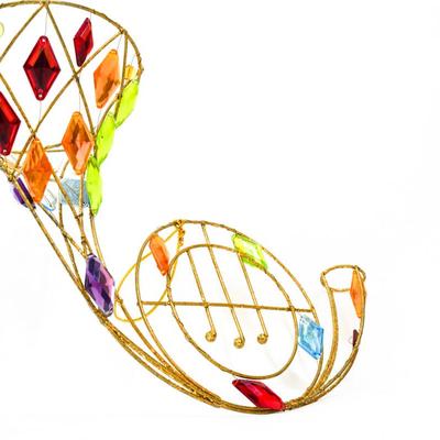 Sale Photo Thumbnail #332: This is a colorful wall hanging french horn suncatcher. 10 inches long as listed in picture.