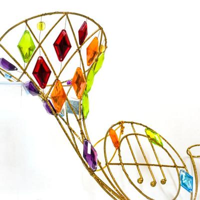 Sale Photo Thumbnail #330: This is a colorful wall hanging french horn suncatcher. 10 inches long as listed in picture.