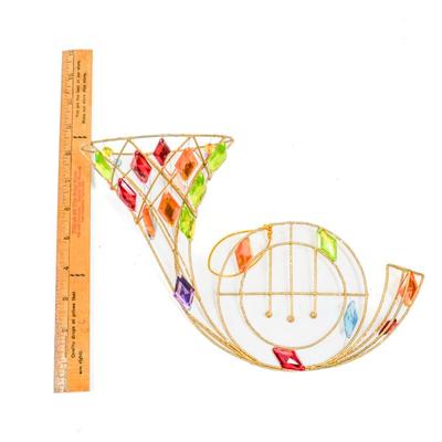 Sale Photo Thumbnail #329: This is a colorful wall hanging french horn suncatcher. 10 inches long as listed in picture.