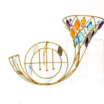 Sale Photo Thumbnail #324: This is a colorful wall hanging french horn suncatcher. 10 inches long as listed in picture.