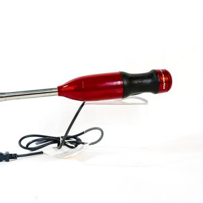 Sale Photo Thumbnail #415: This is a handheld immersion blender used for blending, pureeing, and crushing ingredients. 16 inches long as listed in picture.