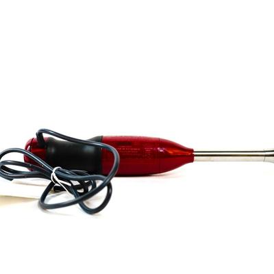 Sale Photo Thumbnail #411: This is a handheld immersion blender used for blending, pureeing, and crushing ingredients. 16 inches long as listed in picture.
