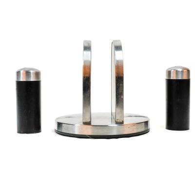 Sale Photo Thumbnail #471: This is a Kamenstein napkin holder with a salt and pepper caddy. It is a kitchen accessory designed to hold napkins and includes two shakers for salt and pepper. 6 inches long as listed in picture.