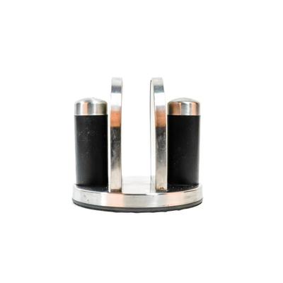 Sale Photo Thumbnail #469: This is a Kamenstein napkin holder with a salt and pepper caddy. It is a kitchen accessory designed to hold napkins and includes two shakers for salt and pepper. 6 inches long as listed in picture.