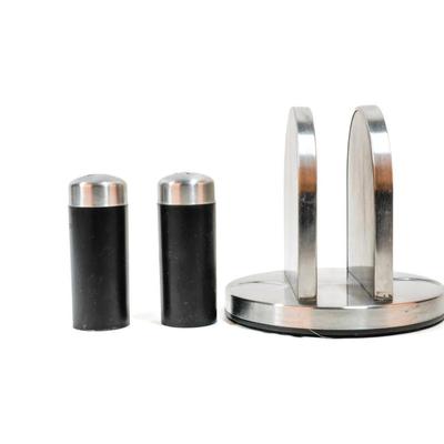Sale Photo Thumbnail #473: This is a Kamenstein napkin holder with a salt and pepper caddy. It is a kitchen accessory designed to hold napkins and includes two shakers for salt and pepper. 6 inches long as listed in picture.