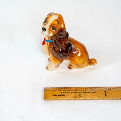 Sale Photo Thumbnail #357: Lady and the Tramp figurines from the 1955 animated Disney film. These figurines are made in Japan during 1950-1960s. These figurines were part of a larger collection of a Disney merchandise from that era. Both are 3 inches long as listed in picture.