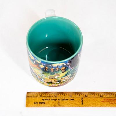 Sale Photo Thumbnail #365: Disney store Bambi collectible mug. This mug features scenes from the movie Bambi with characters including Bambi, Thumper the rabbit, Flower the skunk , and the Friend Owl. Its a ceramic mug with a teal-colored interior.