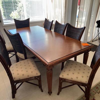 Sale Photo Thumbnail #4: Tommy bahama dinning room table in EXCELLENT condition, always had a cloth on it and seat covers. Comes with seat covers as well to protect the them. No scratches. Has a leaf in it so it can get smaller. 44 inches wide x 92inches long WITH leaf 62 inches 