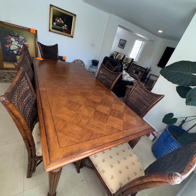 Sale Photo Thumbnail #6: Tommy bahama dinning room table in EXCELLENT condition, always had a cloth on it and seat covers. Comes with seat covers as well to protect the them. No scratches. Has a leaf in it so it can get smaller. 44 inches wide x 92inches long WITH leaf 62 inches 