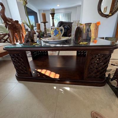 Sale Photo Thumbnail #8: Tommy bahama table for living room. In EXCELLENT condition with glass top that can be removed but it’s supposed to be on there. 3feet wide x 20 1/2 inches tall x  53 inches long