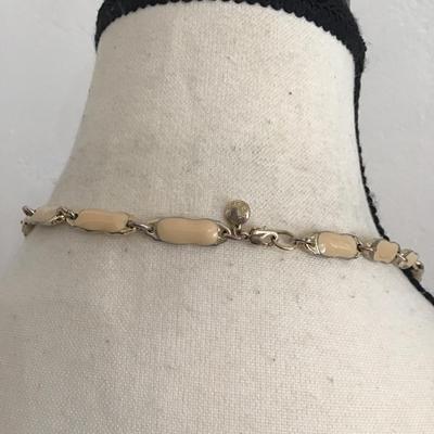 Sale Photo Thumbnail #223: Beautiful vintage, JC crew ivory enamel colored gold tone necklace. Please see attached photos.
