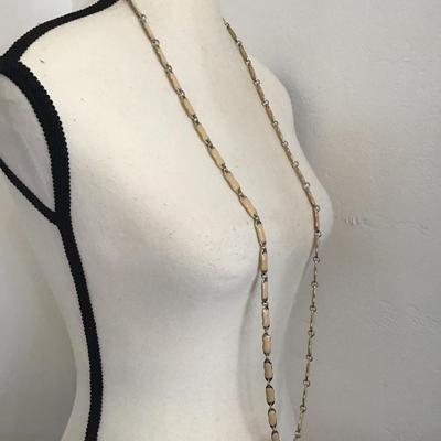 Sale Photo Thumbnail #222: Beautiful vintage, JC crew ivory enamel colored gold tone necklace. Please see attached photos.
