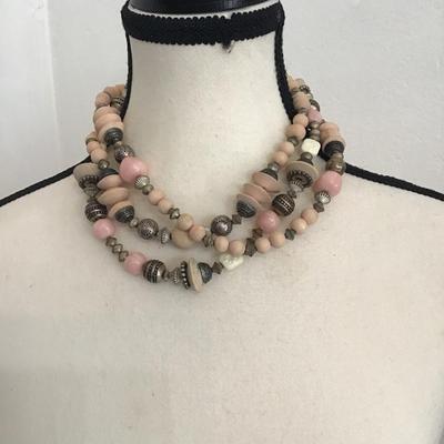Sale Photo Thumbnail #249: Beautiful, multi strand beaded necklace with pink and cream, silver toned beads. Please see attached photos.