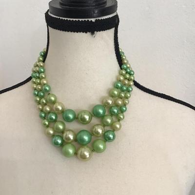 Sale Photo Thumbnail #256: Beautiful vintage, triple strand necklace with beads shades of different green and cream. Please see attached photos.