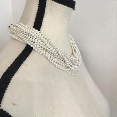 Sale Photo Thumbnail #109: Vintage multi strand, white beaded necklace with floral clasp. Please see attached photos.