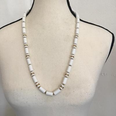 Sale Photo Thumbnail #164: Beautiful vintage, Lucite barrel bead necklace with gold tone spacers. Please see attached photos.