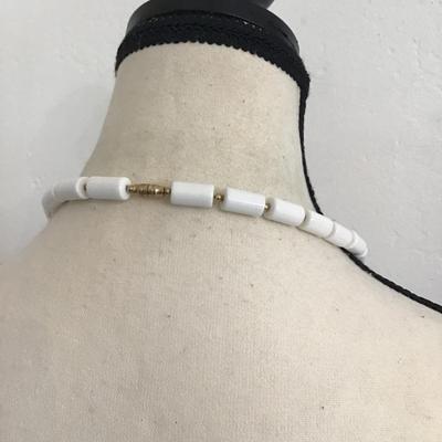 Sale Photo Thumbnail #166: Beautiful vintage, Lucite barrel bead necklace with gold tone spacers. Please see attached photos.