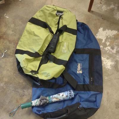 2 DUFFLE BAGS AND AN UMBRELLA