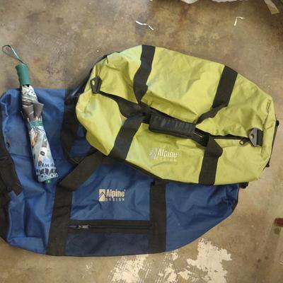 2 DUFFLE BAGS AND AN UMBRELLA