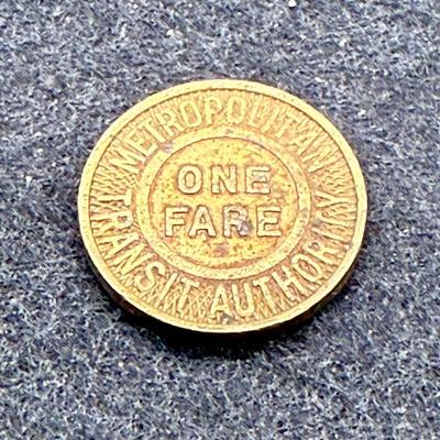 Sale Photo Thumbnail #451: Slightly larger than a US penny. Rare, in very good condition. The Boston MTA ran from 1947 until 1964. This token is likely from the late 1940's or 1950's.