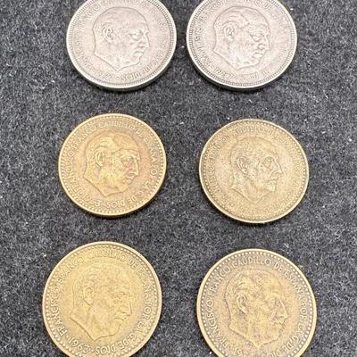 Sale Photo Thumbnail #480: 6 coins: four 1 Paseta coins (authorization dates are: 1953, 2 from 1963, and 1966; minting dates are 1956, 1963, 1965 and 1967) and two 5 Paseta coins (both authorized in 1957, minted in 1960 and 1964). All coins feature the image of Francisco Franco, Sp