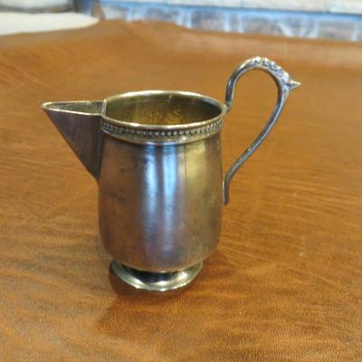 Sale Photo Thumbnail #30: Cute little silver plated creamer, measuring 4.5" tall