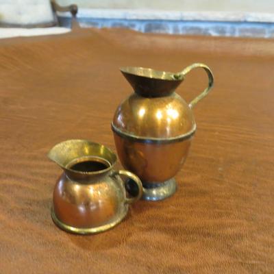 Sale Photo Thumbnail #31: Set of 2 small copper pitchers, measuring 1" and 2"