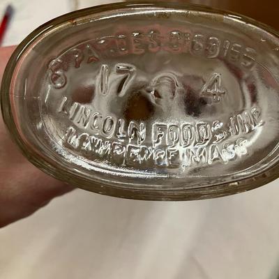 Sale Photo Thumbnail #77: Vintage 1950's Abraham Lincoln glass bank bottle, with chocolate syrup label, approx 8.5" tall