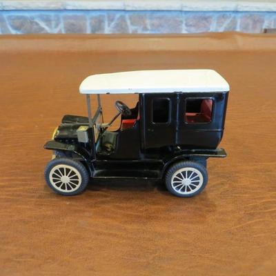 Sale Photo Thumbnail #78: Friction powered black Ford Model T Town Car, measures 6" W x 4" H