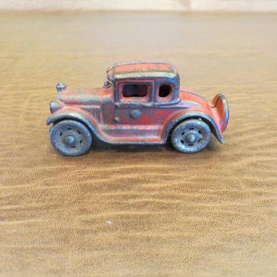 Sale Photo Thumbnail #80: 1920s Cast Iron coupe with spare tire and nickel wheels, measures 8" long