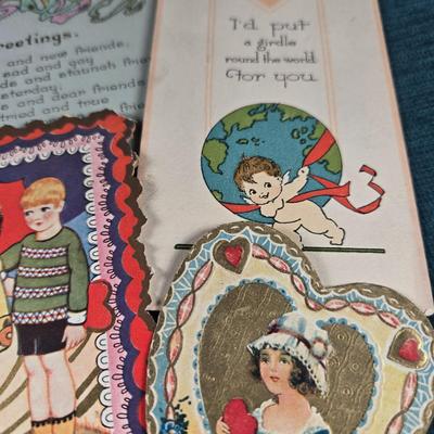 Sale Photo Thumbnail #152: This auction lot is for Victorian Valentines + Hearts.  Thiis a romantic grouping of 7 wonderful Victorian Valentines plus 2 Heart Pendants and a pair of Red Heart pierced Earrings.  The heart pendants are silver-toned and the earrings look to be red enam