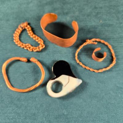 Sale Photo Thumbnail #155: This auction lot is for an All About Copper Jewelry Grouping. This is a fun grouping of handmade 5 solid copper pieces of copper with a Murano Glass Heart pendant with copper accents..  The copper jewelry consists of 4 different bracelets and 1 adjustable