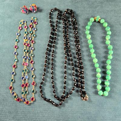 Sale Photo Thumbnail #158: This auction lot is for a Trio of Quality Beaded Necklaces. This is a grouping of 3 quality beaded costume jewelry necklaces. The first one is a multi-colored glass stones encased in sealed polished brass with matching pierced earrings.  It hangs down abo