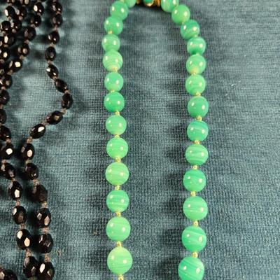 Sale Photo Thumbnail #161: This auction lot is for a Trio of Quality Beaded Necklaces. This is a grouping of 3 quality beaded costume jewelry necklaces. The first one is a multi-colored glass stones encased in sealed polished brass with matching pierced earrings.  It hangs down abo