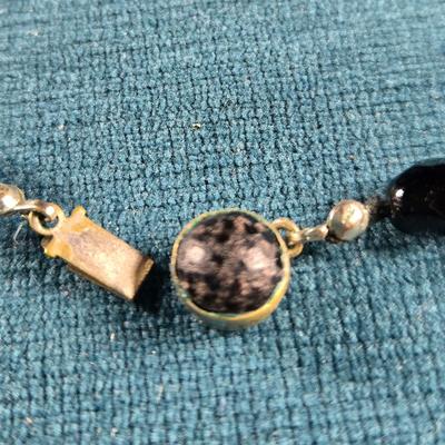 Sale Photo Thumbnail #164: This auction lot is for a Trio of Quality Beaded Necklaces. This is a grouping of 3 quality beaded costume jewelry necklaces. The first one is a multi-colored glass stones encased in sealed polished brass with matching pierced earrings.  It hangs down abo