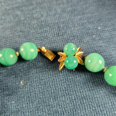 Sale Photo Thumbnail #163: This auction lot is for a Trio of Quality Beaded Necklaces. This is a grouping of 3 quality beaded costume jewelry necklaces. The first one is a multi-colored glass stones encased in sealed polished brass with matching pierced earrings.  It hangs down abo