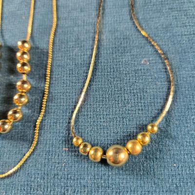 Sale Photo Thumbnail #167: This auction lot is for Vintage "Add a Bead" Necklaces. This is a pair of "Add a Bead" necklaces that were popular in the late 70's.  We recall you could purchase and add as many beads as you wanted or could afford.  If we remember correctly the chains we