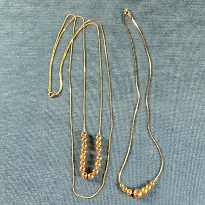 Sale Photo Thumbnail #165: This auction lot is for Vintage "Add a Bead" Necklaces. This is a pair of "Add a Bead" necklaces that were popular in the late 70's.  We recall you could purchase and add as many beads as you wanted or could afford.  If we remember correctly the chains we