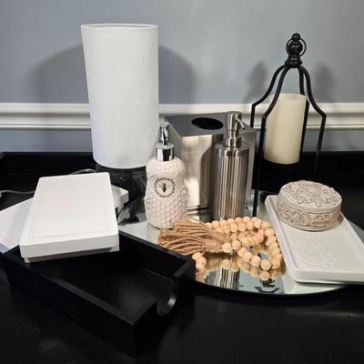 LOT 120Y: Vanity Set Including Lotion Jar Dispensers, Tissue Box Holder, Wood Trays, Ceramic Tray, Trinket Box with Lid, Small Lamp, and...