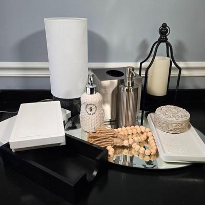 LOT 120Y: Vanity Set Including Lotion Jar Dispensers, Tissue Box Holder, Wood Trays, Ceramic Tray, Trinket Box with Lid, Small Lamp, and...