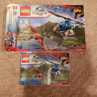 LOT 129B: Lego Jurassic World Sets-Raptor Rampage, Dilophosaurus Ambush, Pteranodon Capture, T Rex Tracker, Indominus Rex Breakout