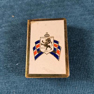 Sale Photo Thumbnail #169: This auction lot is for a WWII British War Relief Match Society Holder. It is brass and enamel with the cardboard match drawer inside.  The one side is engraved - "There will always be an England".  It is in good used condition and contains no matches.